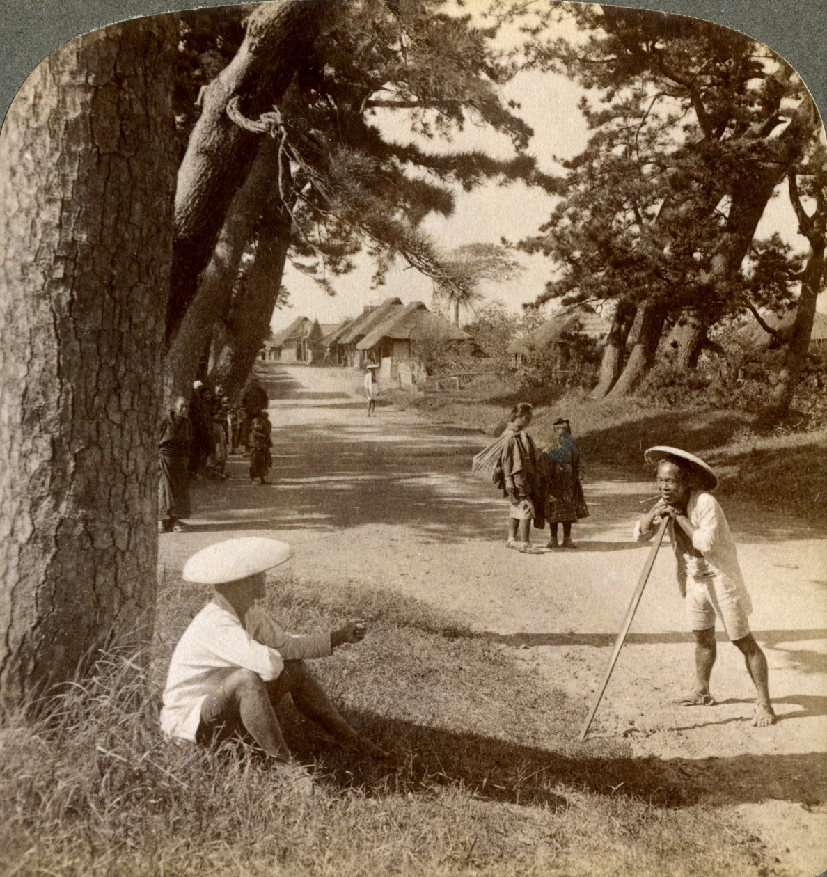 Travellers Resting Under the Pines at Suzukawa, Old Post Road from Tokyo to Kyoto, Japan by Underwood and Underwood