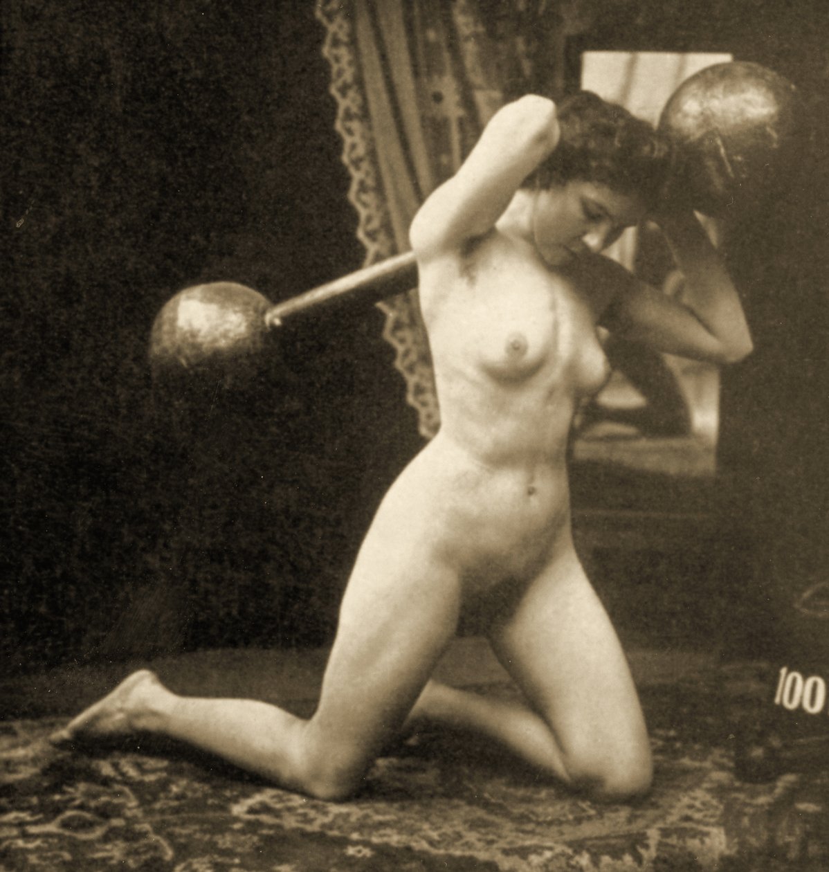 Female Nude Exercising with a Globe Barbell by Unknown