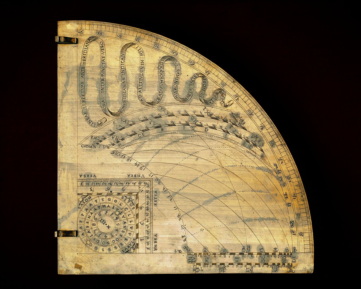 Brassy dial showing the sun