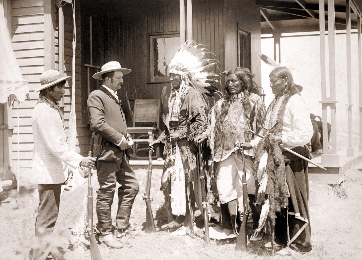 Three Cheyenne dressed in ceremonial costume and wearing guns greet a White accompanied by an interpreter by Unknown artist