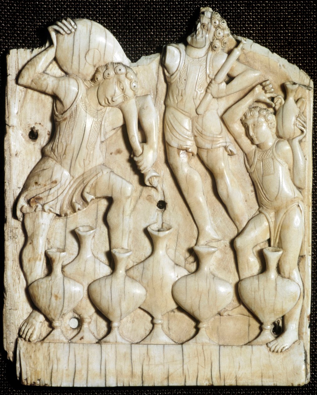 Wedding of Cana: the servants fill with water six jars that Jesus Christ will turn into wine (Carved ivory tablet, 11th century) by Unknown artist