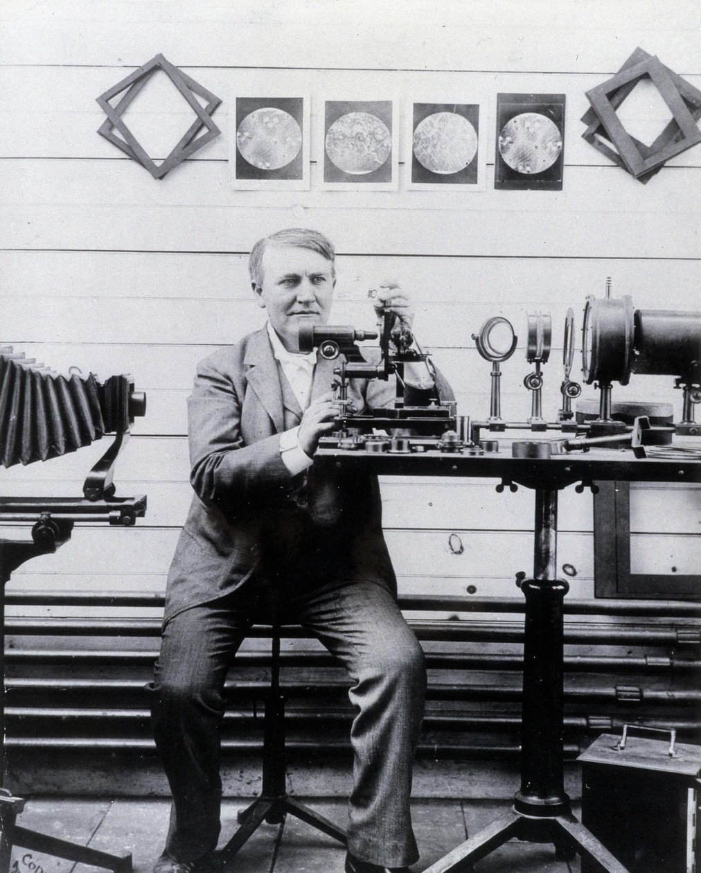 Photo of Thomas Alva Edison in front of his phonograph by Unknown photographer