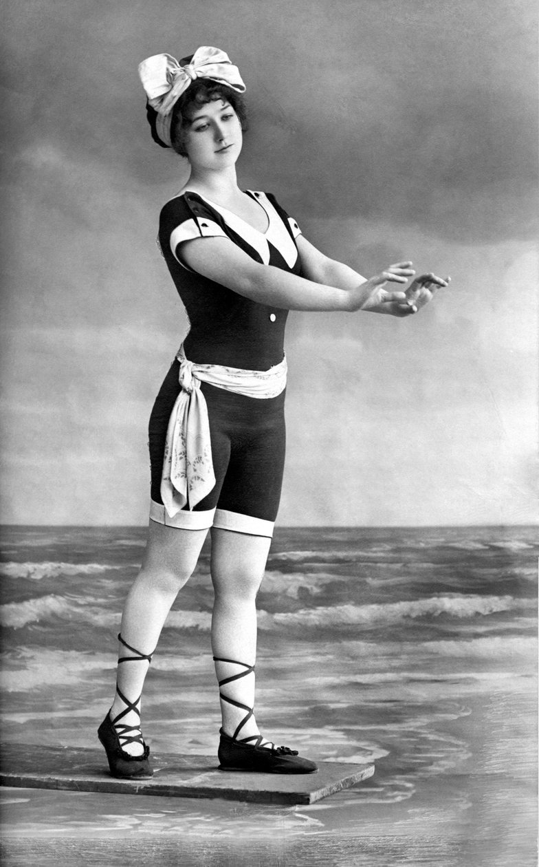 Woman in Swimsuit and Beach Shoe by Unknown photographer