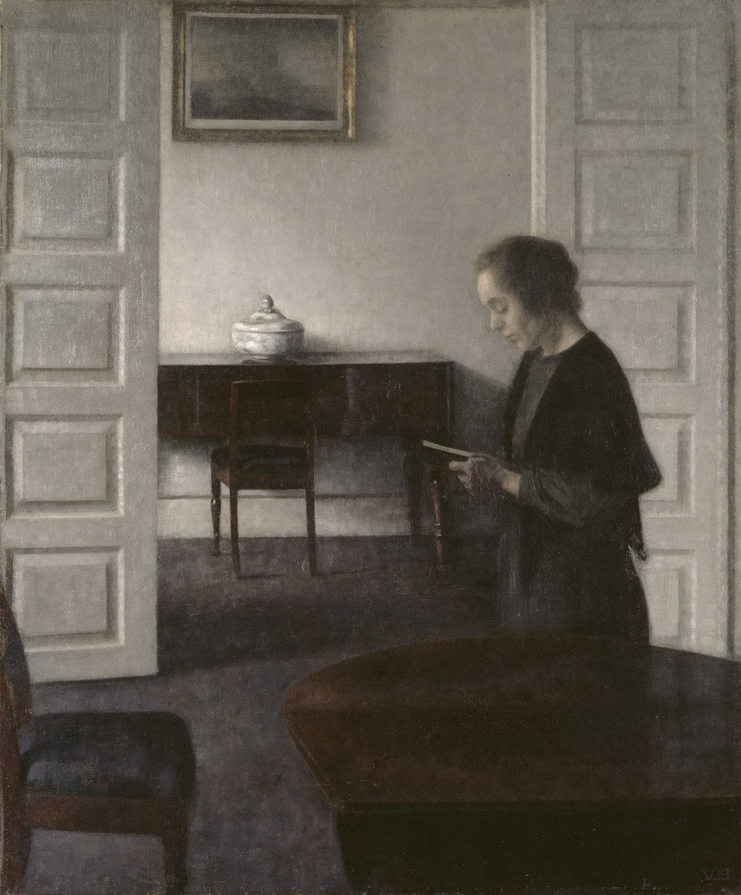 Interior with a Lady Reading by Vilhelm Hammershoi