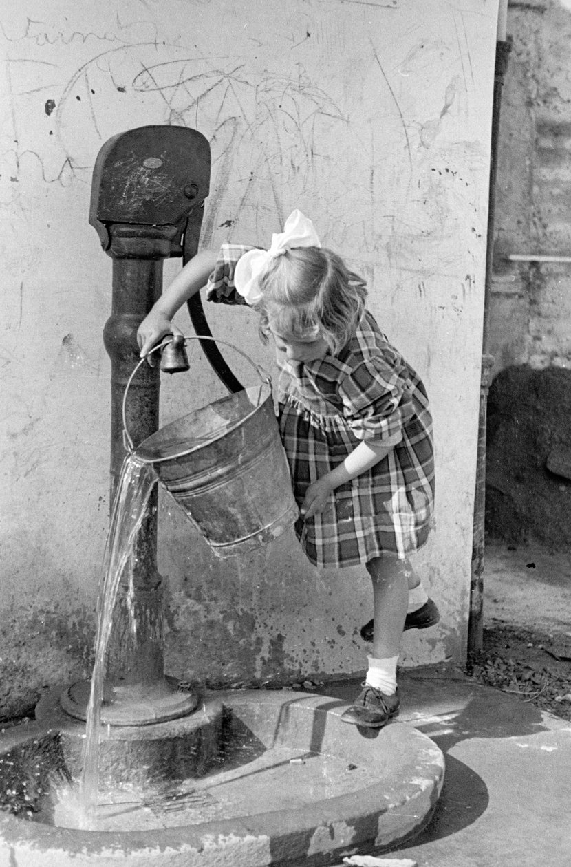 Little Girl Emptying a Bucket of Water in a Pump Fountain, 9th May 1939 by Vincenzo Balocchi