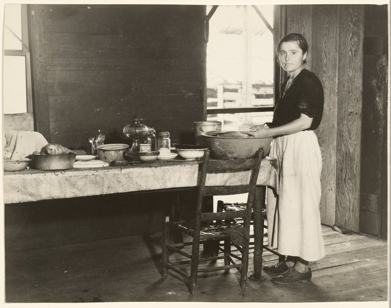 Elizabeth Tengle at the Kitchen Table / Paralee Ricketts Working in the Kitchen by Walker Evans