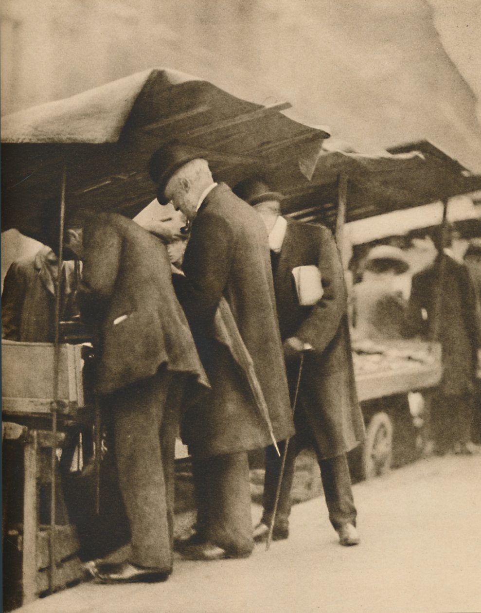 At One of the Bookstalls of the Farringdon Road Market by Walter Benington