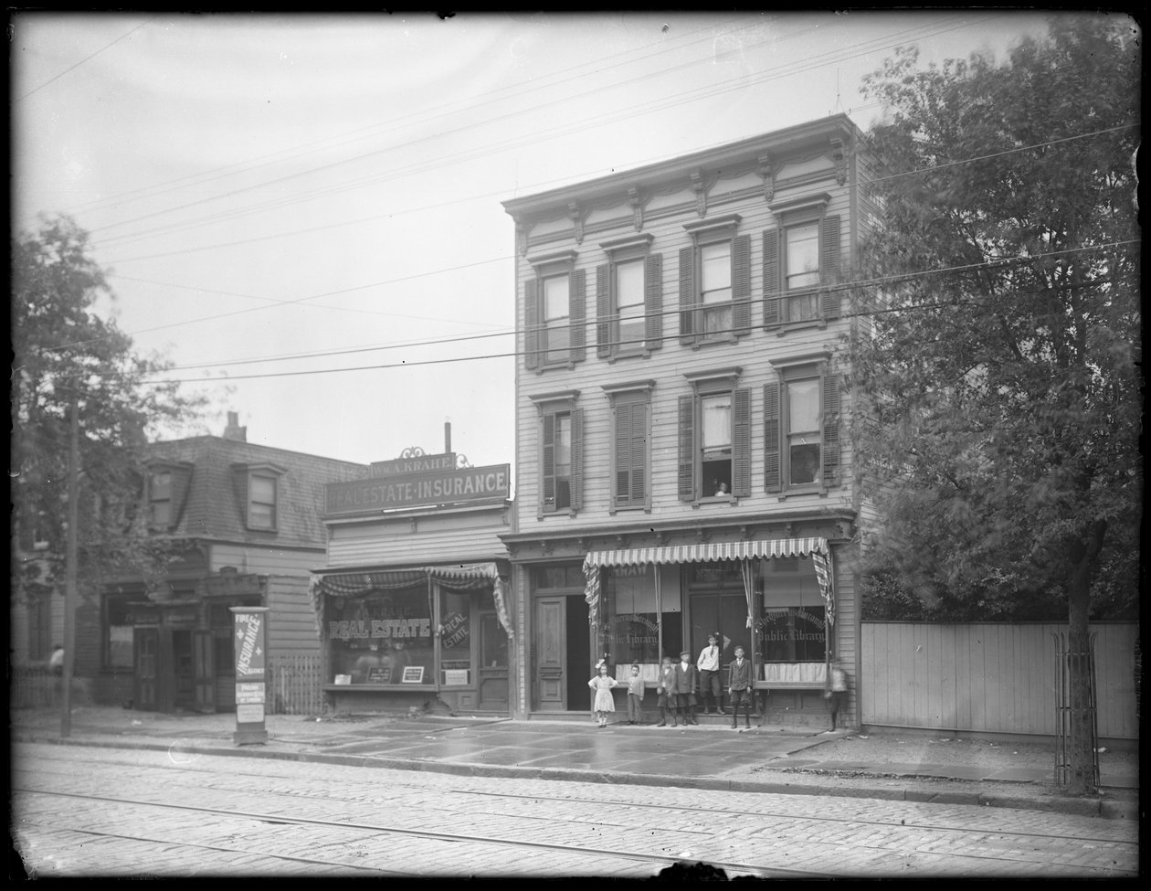 Seven Children Pose in Front of an Unidentified Branch of the Queens Borough Public Library, New York, c.1910 by William Davis Hassler