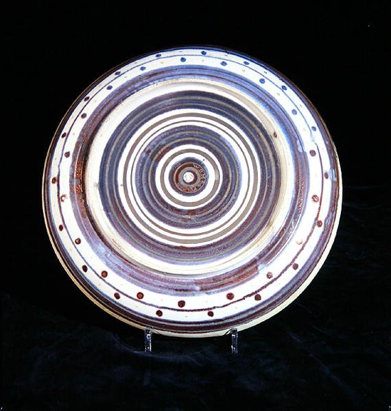 Charger with concentric circles of white, blue, purple and gold lustre by William de Morgan