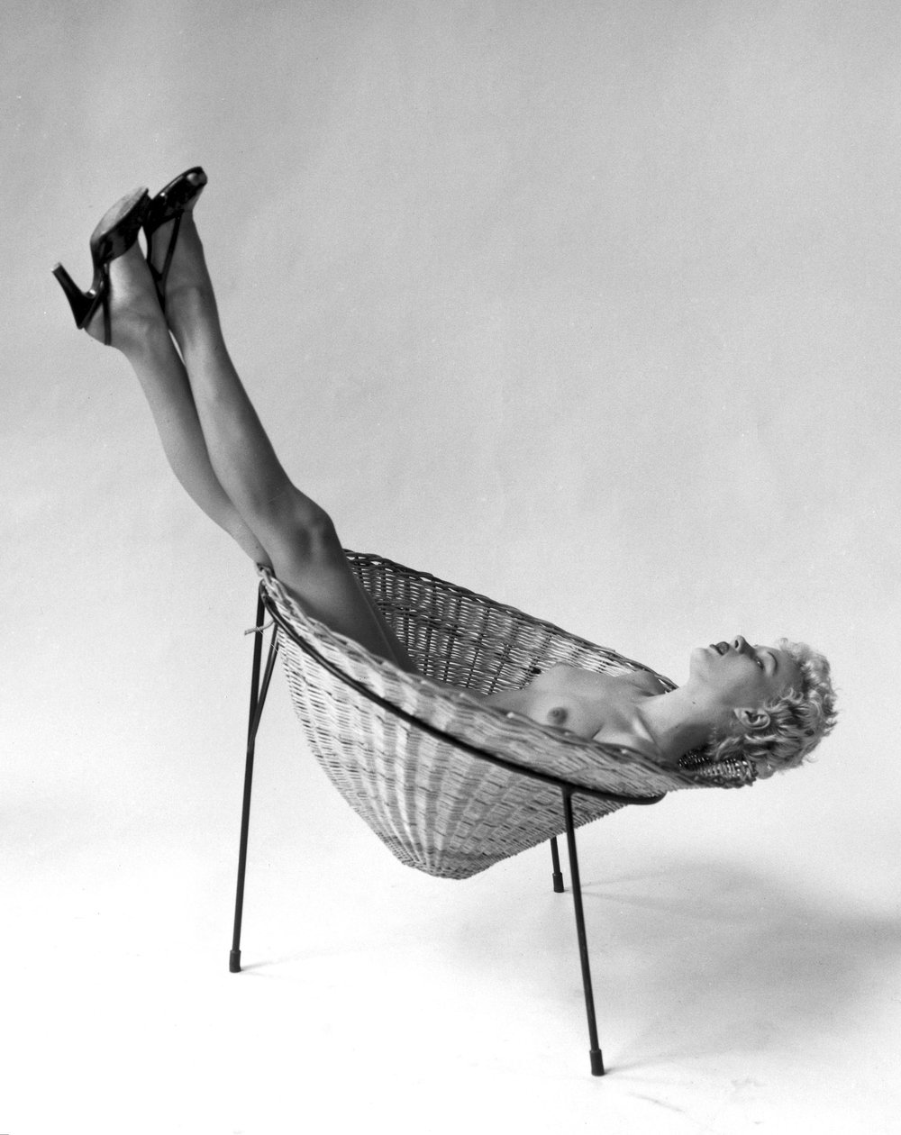 Nude Reclining in Basket Chair, 3 May 1955 by Zoltan Glass