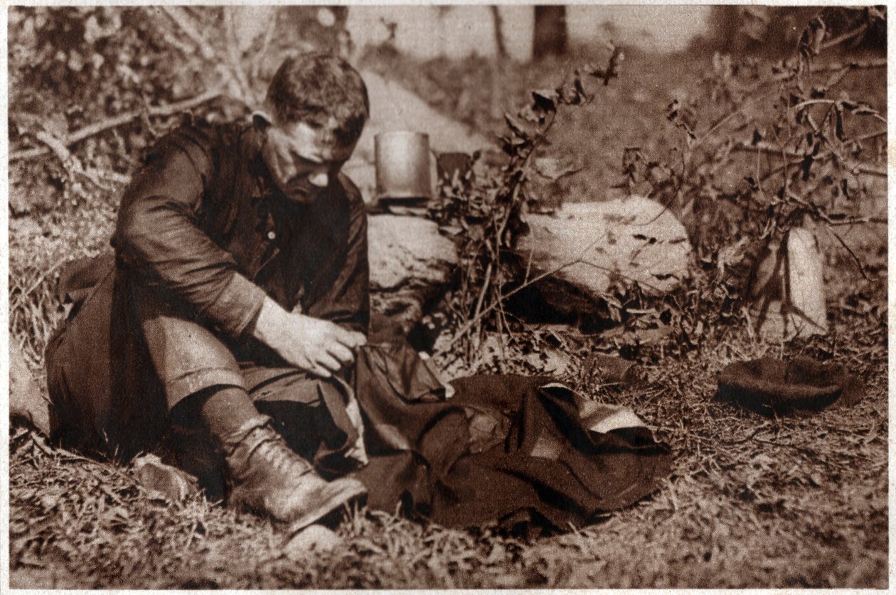 Tramp repairing his clothes by . .