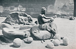 A Yoruba Man Engraving Clay Bowls and Water Jars, Lagos Hinterland, Southern Nigeria, 1912