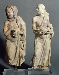 Two statuettes of standing monks, from Hadda