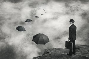 Man and Floating Umbrellas