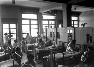 Villa Rosa Maltoni Mussolini: female students tidying their bedrooms by Fratelli Alinari