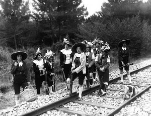 Villa Rosa Maltoni Mussolini: group of adolescents posing on railway tracks, wearing traditional Friulian costumes