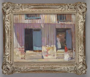 Woman walking in front of buildings