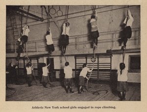 Athletic New York school girls engaged in rope climbing