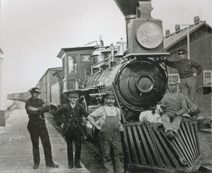 A freight train of the Central Pacific railway with crew at Mill City, Nevada by American Photographer