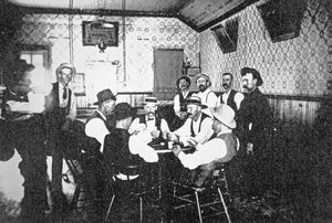 Playing cards in a Western saloon, c.1900
