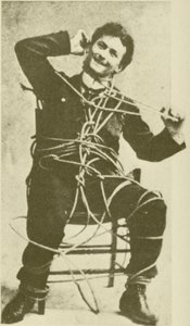 The young Harry Houdini doing an escape rope trick in 1898 by American Photographer