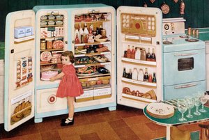 Girl Getting a Pink Cake Out of a Huge Refrigerator Stuffed With Food by American School