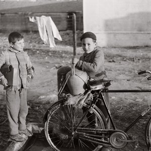 Child Water Carrier on Bicycle by Ando Gilardi