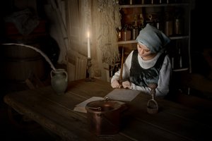 Woman Writing by Candlelight