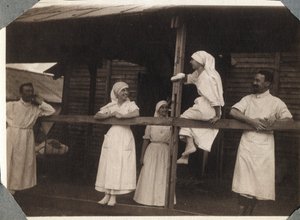 First World War 1914-1918: Nurses and Doctors in Blouse Talking in Couville, Manche, Lower Normandy, France. Anonymous Photograph July 1917. Private Collection, Stella.