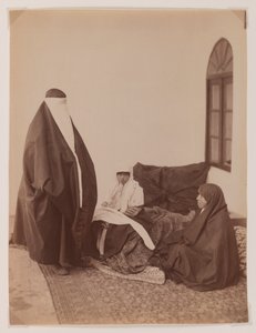 Two veiled women and a child by Antoin Sevruguin