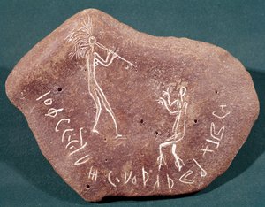 Stone inscribed with a dancer, flute player and a safaitic inscription