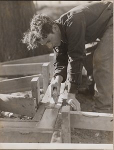 Mason Smooths Cement While Pouring a Foundation by Arnold Eagle