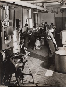 Six Men Working in a Welding Workshop by Arnold Eagle