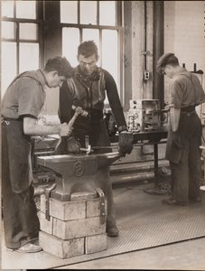 Two Men Hammer Metal on an Anvil by Arnold Eagle