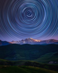 Star Trails Over Mountains by Asef Azimaie