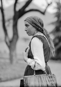 Country woman in traditional conservative clothing, probably Italy but possibly Turkey
