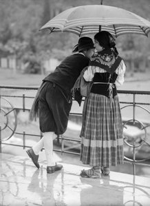 Young couple with umbrella, Italy