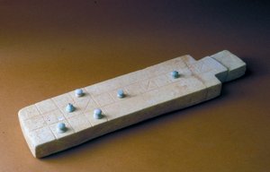 Game board with playing pieces, from Tell Beit Mirsim, Jordan, c.2000-1700 BC
