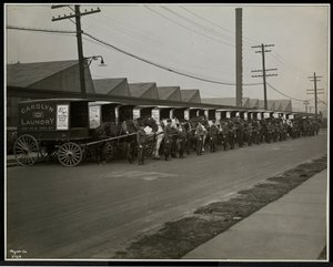 Horsedrawn Delivery Wagons Parked Outside the Carolyn Laundry at 111 East 128th Street, East Harlem, New York, 1929 by Byron Company