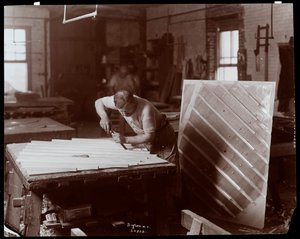 Man Working in the Hardman, Peck and Co. Piano Factory by Byron Company