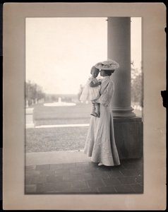 Mrs. Clarence Mackay and child in the portico of Harbor Hill, Long Island 1898-1910 by Byron Company