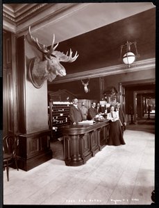The lobby and registration desk at the Park Avenue Hotel, 1901 or 1902