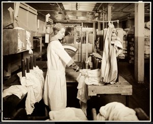 Women tagging bags of laundry at the Carolyn Laundry, East Harlem, New York, 1928