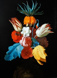 A bouquet of flowers in a sculpted vase