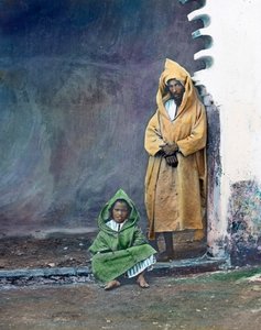 Moorish Merchant with Little Son, Morocco, circa 1910. Carl Simon Archive