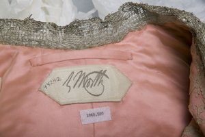 Charles Frederick Worth maker label from inside evening coat belonging to Bertha Palmer, c.1902. Worth, Paris.
