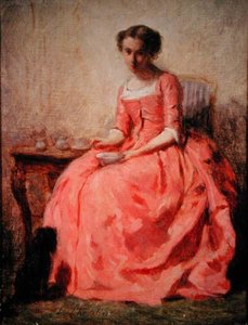 Girl in a pink dress at a table