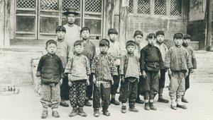 Schoolteacher and pupils by Chinese Photographer