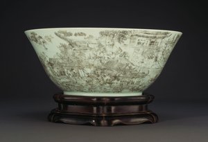 A large incised porcelain bowl depicting a continuous scene of ladies in the palace grounds