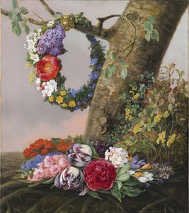 A Bouquet of Flowers at the Foot of a Tree. A Flower Wreath Hangs on a Branch